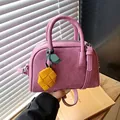 Fashionable pink textured leather pillow bag with unique yellow leaf charm for women - With Charm / Purple