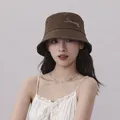 Stylish brown bucket hat worn by a model for summer sun protection fashion - 56-58cm / Brown