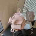 Trendy pink mini backpack with stylish bow decoration and heart charm in Korean style - With Charm Style / Pink with Pendant