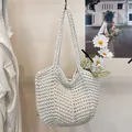 Handmade white knitted shoulder bag with a minimalist niche design for summer season - White