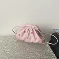 Elegant minimalist light pink polka dot cloud pouch bag with slim crossbody shoulder strap - Pink