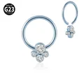 Detail view of G23 titanium BCR nose ring featuring a four-stone clear CZ cluster design - White Rhinestone BCR Ring / 1 Piece / Light Blue