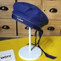 Close-up detail of a blue beret hat featuring embroidered Forever text and long ribbon bow - 54-58cm (Adjustable) / Navy Blue