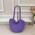 Handcrafted purple knitted underarm tote bag featuring a textured thick woven strap - Purple