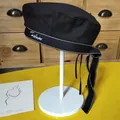 Side view of a stylish black beret hat with Forever embroidery and long dotted ribbon decoration - 54-58cm (Adjustable) / Black