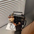 Retro black polka dot crossbody bag with a cute plush teddy bear charm for women - With Charm / Black