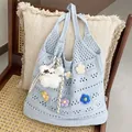Light blue hollow-out crochet tote bag with colorful knitted flower charms - Blue with Charm