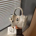 Niche designer grey bucket handbag with cute animal charm and top handle for women - Blue (With Pendant)