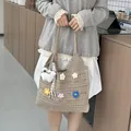 Handmade khaki crochet tote bag with colorful flower patches and hollow-out knit - Khaki with Pendant