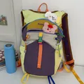 Outdoor hiking backpack in vibrant purple and lime green dopamine color patchwork design - Backpack / Large Capacity / White and Purple