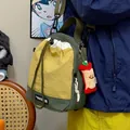 Bolso bandolera deportivo casual de nailon amarillo y verde para exterior y viaje. - Con Colgante / Amarillo