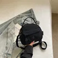 Bolso pequeño negro versátil de nailon con asa y bandolera para mujer, modelo nuevo 2026 - Negro