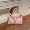 Trendy pink underarm hobo tote bag for women featuring a stylish buckle strap closure - Pink
