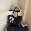 Stylish black geometric embossed tote bag for women with decorative silk scarf accessory - Black