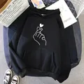 Black oversized fleece hoodie with a minimalist heart hand gesture graphic print - S / Tops / Finger Heart Black