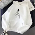 Detail of white oversized fleece hoodie with black finger heart line art print - S / Tops / Finger Heart White