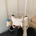 Beige pebble grain leather shoulder bag with cute bear charm and adjustable strap - Style With Pendant / Off White