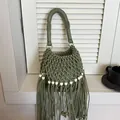Hand-woven summer bucket bag in sage green with long fringe and white beads - Green