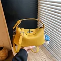 Stylish yellow pebbled leather bucket bag with cute bear charm and silver hardware - Style With Pendant / Yellow