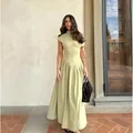 Elegante vestido largo verde pistacho de manga corta con cintura asimétrica - S / Vestidos / Verde