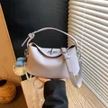 Elegant lavender leather bucket bag with top handle and decorative charm for summer. - Style With Pendant / Purple