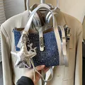 Denim blue bucket bag with silver leather trim and a sparkly star charm accessory - With Star Charm / Dark Denim Blue
