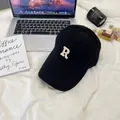 Black brushed baseball cap featuring white embroidered R letter on a white fabric backdrop - 58-65cm (Adjustable) / Black