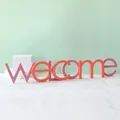 Lettres décoratives WELCOME en bois rose et orange pour une décoration moderne - WELCOME