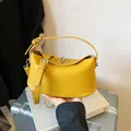 Modern yellow pebbled leather bucket handbag for women with adjustable shoulder strap - Style Without Pendant / Yellow