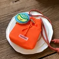 Fashionable vibrant orange mesh crossbody bucket bag with ChicCraze logo patch - With Charm / Orange