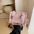 Fashionable pink textured fabric crossbody pillow bag for women with adjustable straps - With Charm / Pink