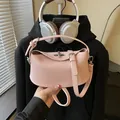 Chic pink pebbled leather bucket bag with silver turn-lock and adjustable strap - Style Without Pendant / Pink