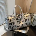 Silver large capacity travel bag with black graffiti letter print and shoulder strap - Silver
