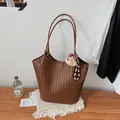 Vintage brown woven leather tote bag for women featuring a cute plush bear charm - Coffee With Charm / Coffee
