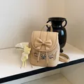 Cute beige faux leather mini backpack for women with decorative bow and puppy motifs - With Pendant / Yellow