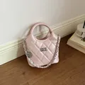 Elegant small pink quilted bucket handbag with silver chain strap and top handle - Pink with Pendant