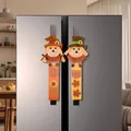 Pair of Thanksgiving scarecrow refrigerator handle covers in a modern kitchen setting. - Scarecrow Fridge Handle Covers (2 Piece Set) / 23x14x2cm