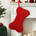 Festive red bone-shaped knitted Christmas stocking gift bag for holiday home and pet decor - Diamond Knit Stocking / Red