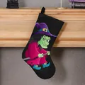 Decorative black Halloween stocking featuring a vibrant cartoon witch print and gift bag - Witch