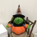 Adorable plush Halloween pumpkin witch doll for festive home and holiday party decorations. - Witch