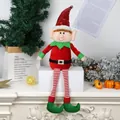 Christmas long-legged elf plush doll in red sequins hat sitting on a white shelf - Red