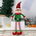 Plush Christmas elf doll ornament with red sequin hat and striped hanging legs. - Green
