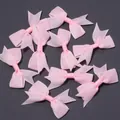 Detailed view of multiple pink grosgrain swallowtail ribbon bows for DIY hair and craft accessories - Size approx 4.5X6cm, ribbon width 1.5cm / Pink