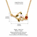 Elegant retro lily of the valley enamel necklace with gold chain and red gemstone pendant - January