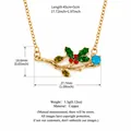 Exquisite gold-plated branch necklace featuring colorful enamel holly leaves and gemstones - December