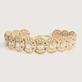 Detailed view of Bohemian belt with linked circular disks and silver metal grommets. - Bright Silver Champagne Gold