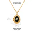 Vintage gold oval locket necklace featuring white dried flowers on a black background - Gold Frame White Flower