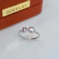 Close-up detail of silver adjustable ring with pink freshwater pearl and letter D - Adjustable Open / Letter D Rhinestone Style / Purple