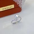 Close-up of elegant freshwater pearl ring with zircon accent on a jewelry box - Adjustable Open / Exquisite Small Flower Rhinestone Style / White