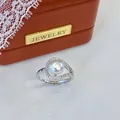 Close-up of elegant freshwater pearl ring with sparkling teardrop stone setting - Adjustable Open / Peach Ring Streamline Style / White